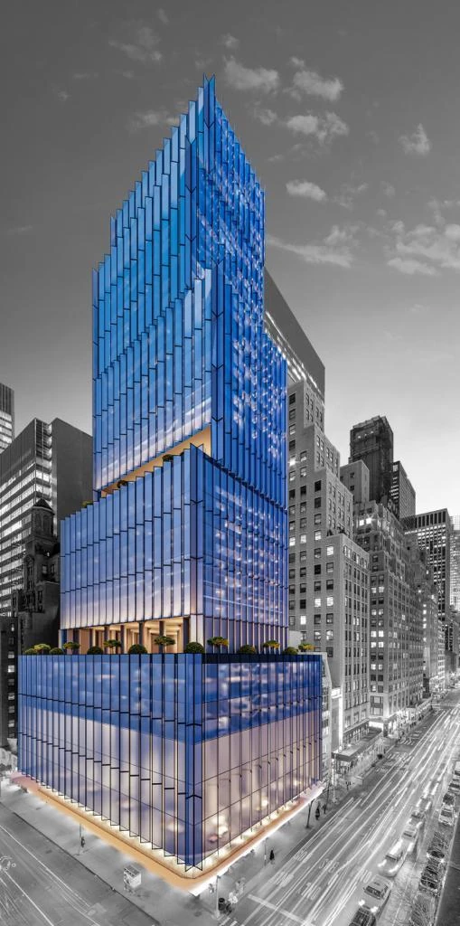 Blue glass residential tower rising over Madison Avenue