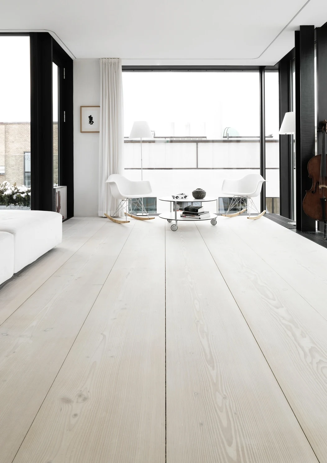 A light interior with pale wood floors and sculptural furniture from the B&Co. Surfaces collection