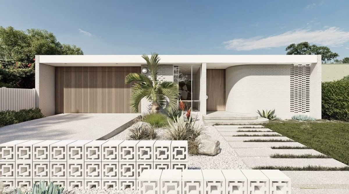 Pale low facade with a slatted garage door, recessed entrance and patterned open-block foreground wall