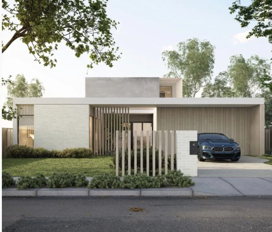 Low white-brick residence behind a planted verge with a dark car parked beside the covered entry