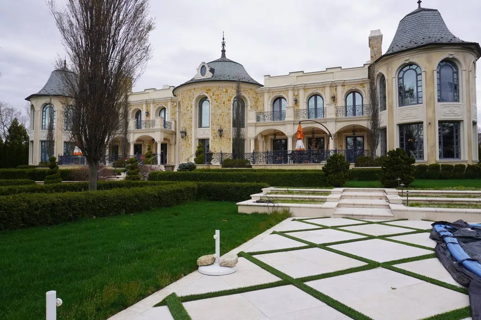 Ch&acirc;teau-style estate above a formal parterre garden